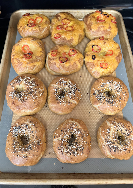 Homemade bagels on baking tray